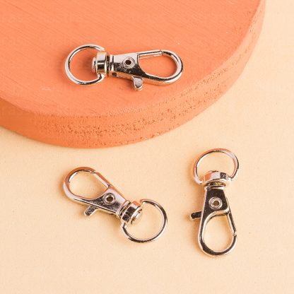 Fecho Mosquetão 31mm Banho Prata - 500 Peças